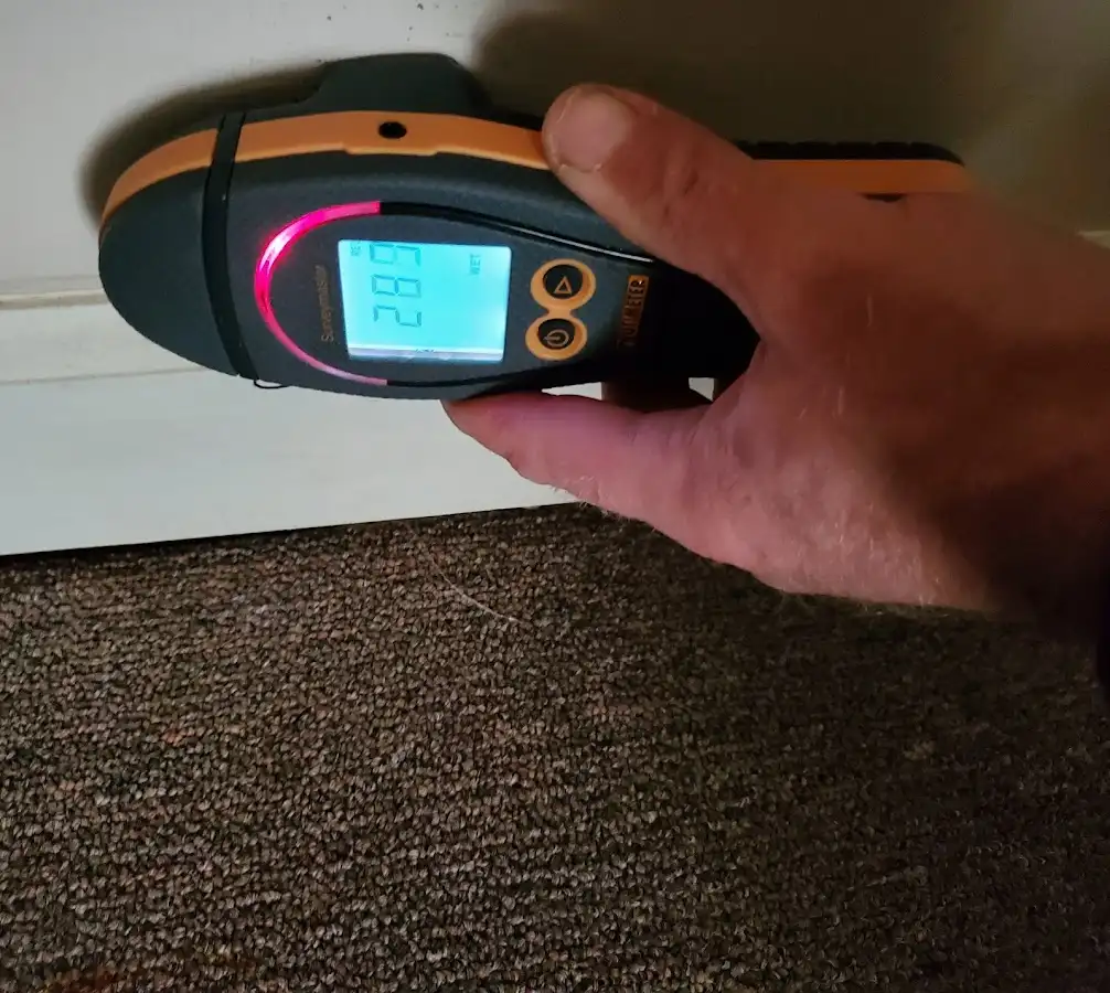 Moisture detection at baseboard during Burst Pipe Cleanup in Claremont